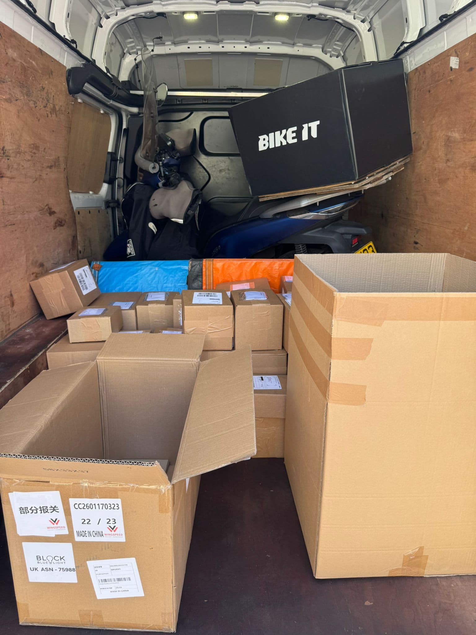 Commercial freight boxes next to a BIKE IT motorcycle box