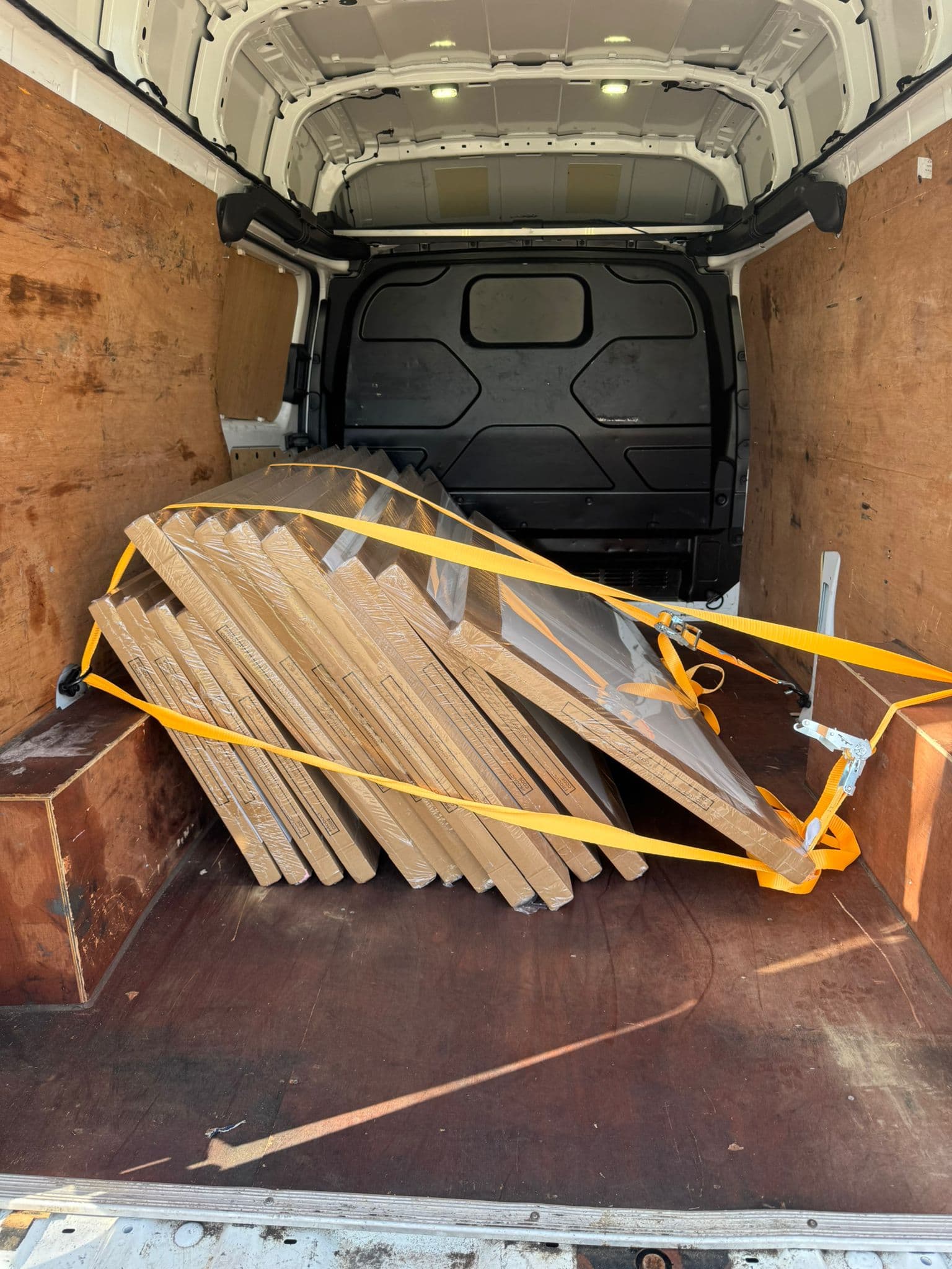 Lengths of timber strapped safely inside the van
