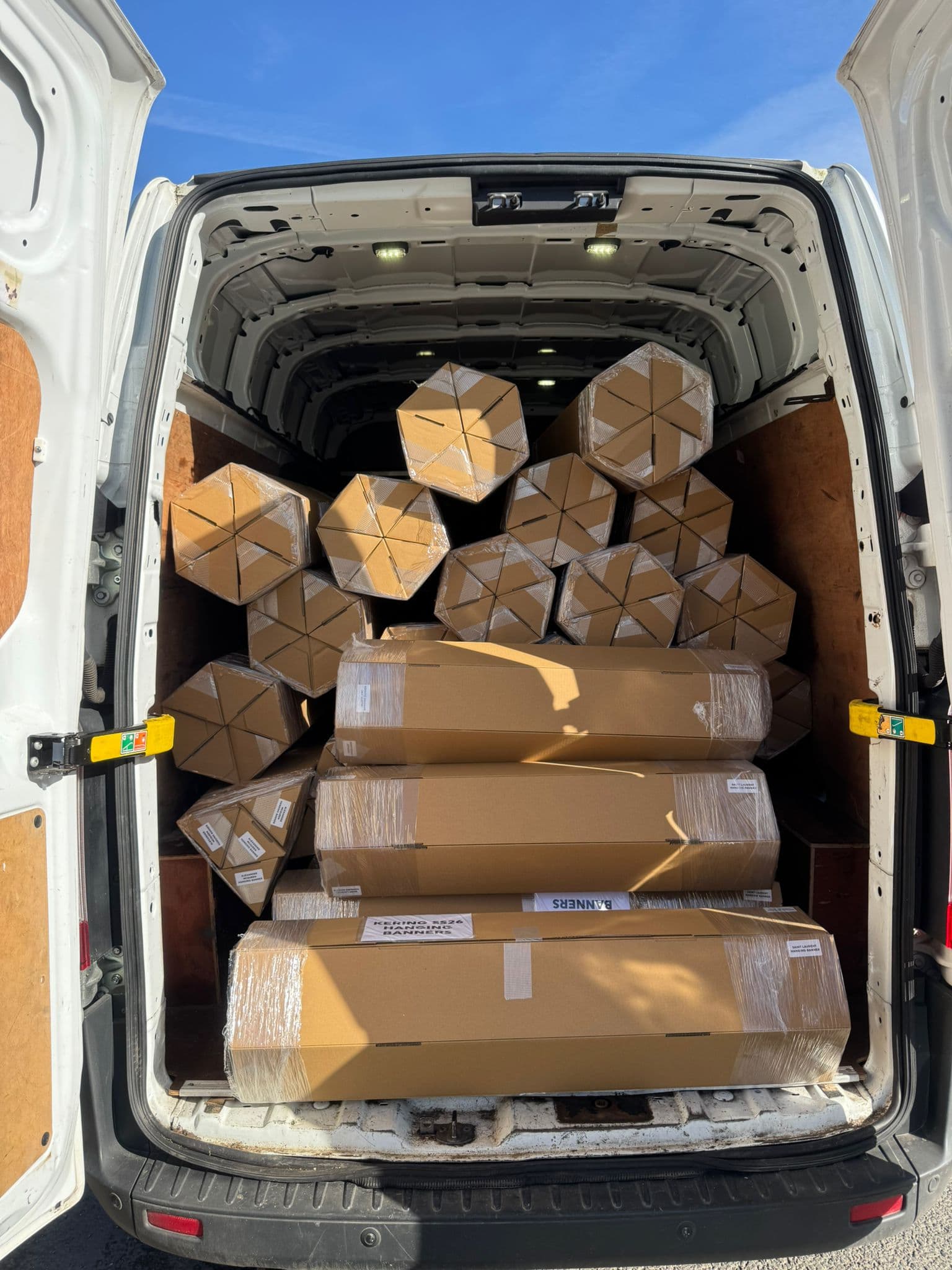 Van fully loaded with hexagonal packages for a scheduled account run